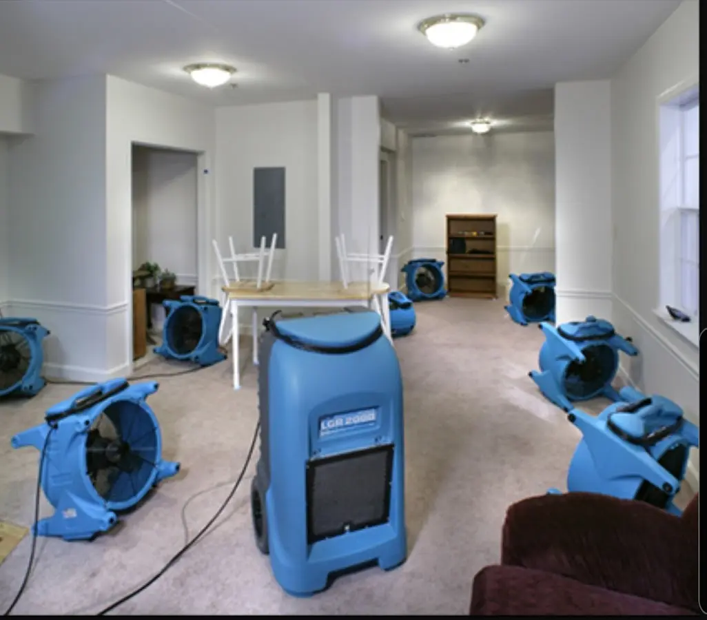 Air movers and dehumidifier setup for Water Damage Restoration in Cohasset